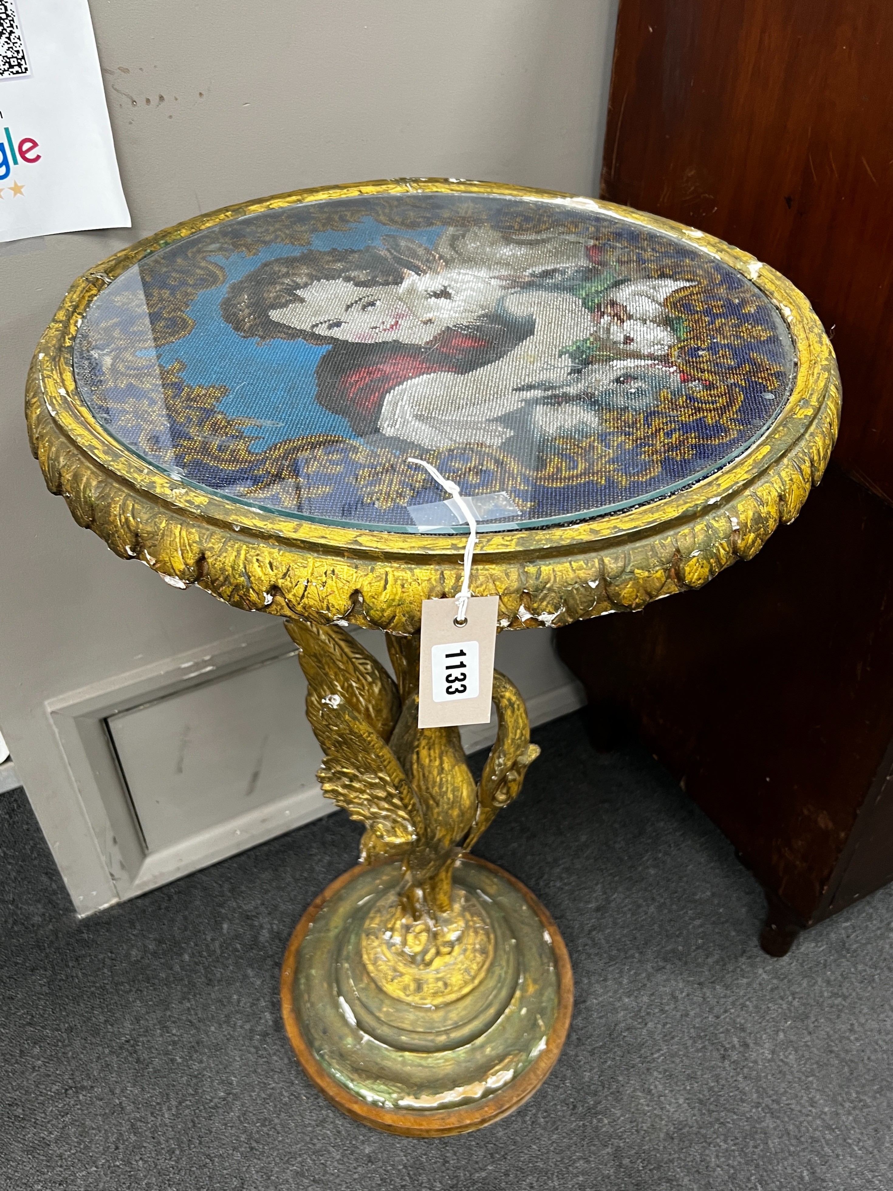 A Victorian giltwood and composition circular centre table with polychrome beadwork top on a carved heron stem and circular platform, diameter 49cm, height 82cm